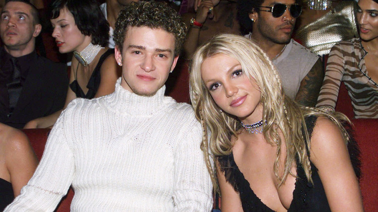 Britney Spears and Justin Timberlake smiling in audience