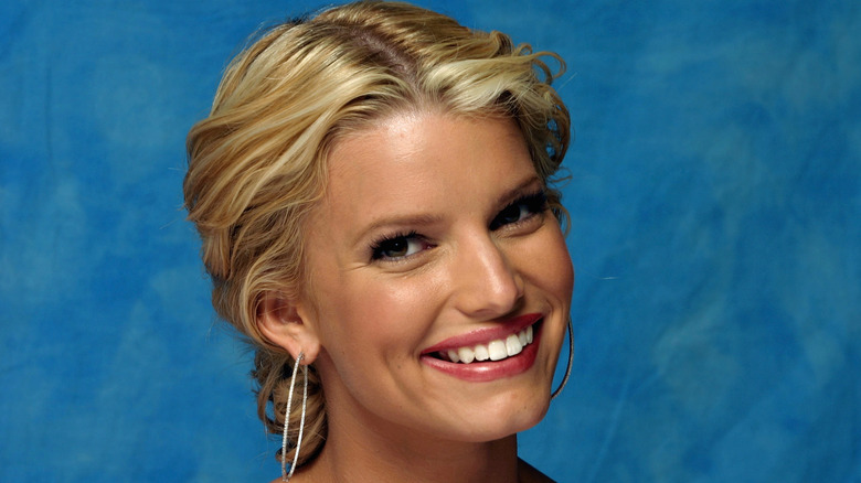 Jessica Simpson smiling with braided hair