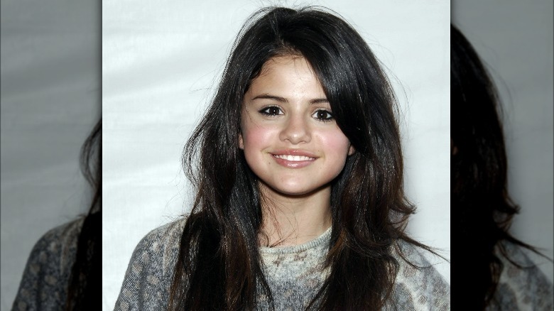 Teenage Selena Gomez smiling relaxed