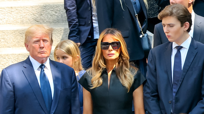 Donald Melania Barron Trump standing