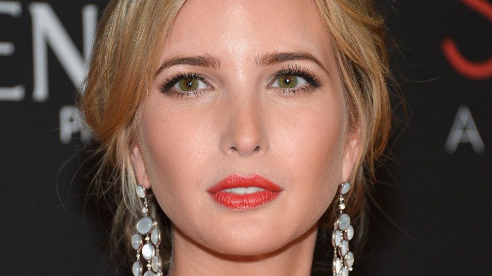 Ivanka Trump sporting dangling earrings at a red carpet event