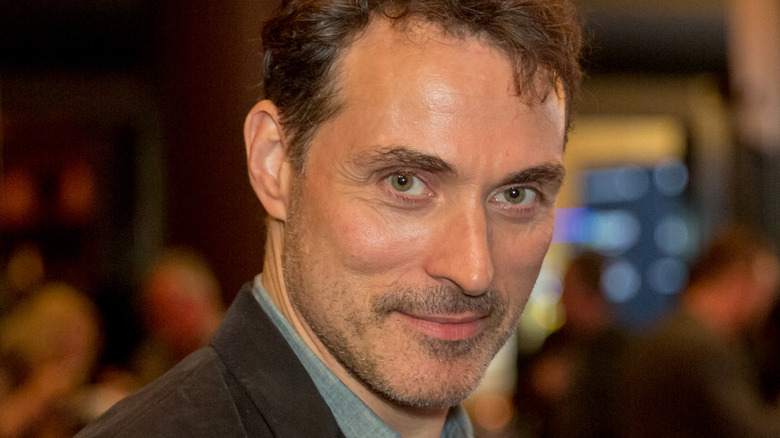 Rufus Sewell posing at event