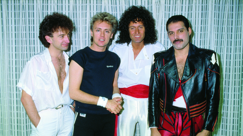 Members of Queen standing together