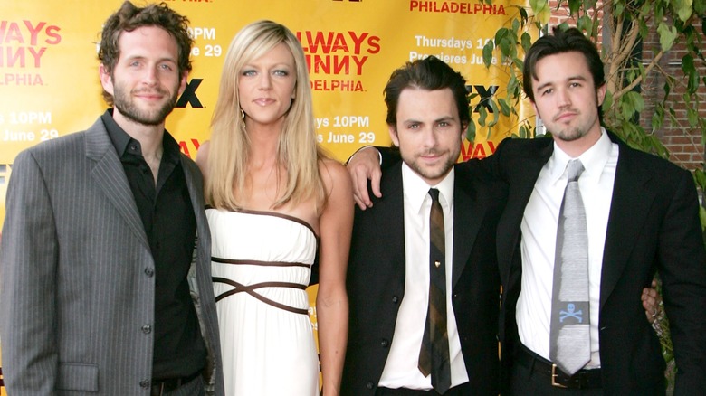 Charlie day posing with Rob McElhenney, Glenn Howerton, and Kaitlin Olson