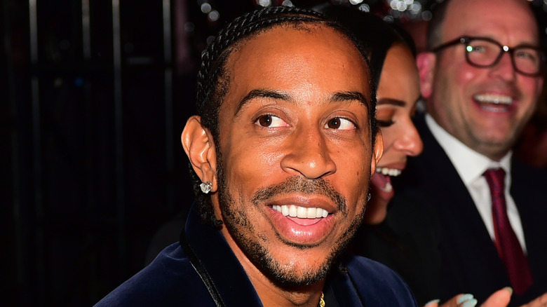 Ludacris smiling wearing earrings