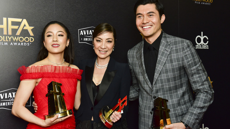 Michelle Yeoh posing with Constance Wu Henry Golding