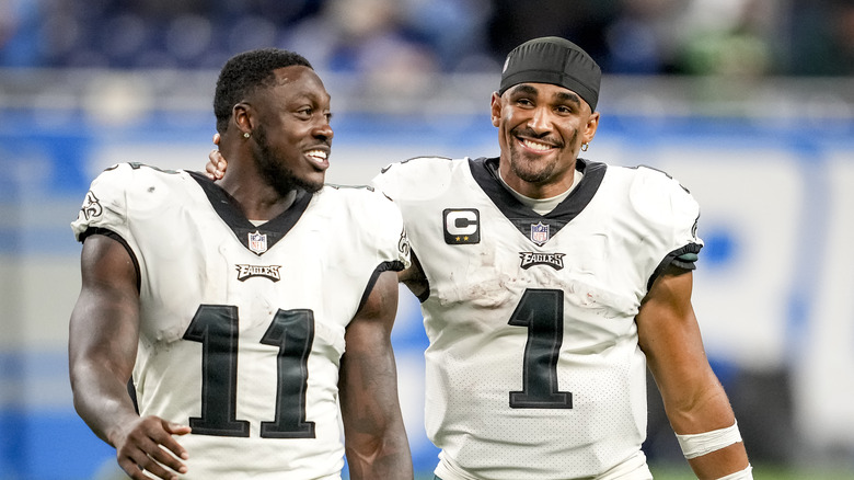 Jalen Hurts embraces A.J. Brown, both smiling