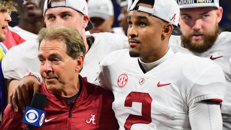 Jalen Hurts hugging coach Nick Saban