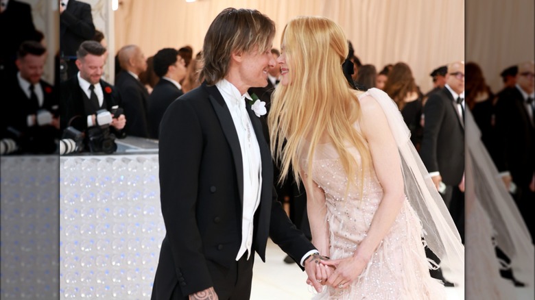 Keith Urban and Nicole Kidman hold hands and nuzzle