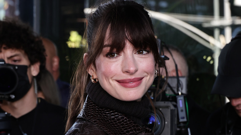 Anne Hathaway grinning