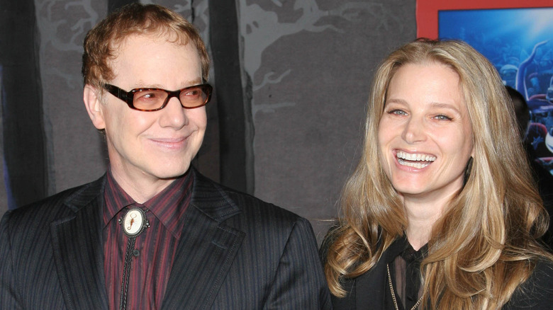 Danny Elfman and Bridget Fonda both smiling