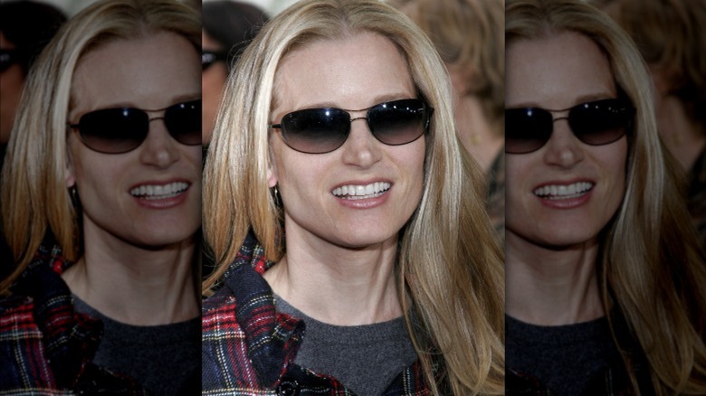 Bridget Fonda wearing sunglasses, smiling