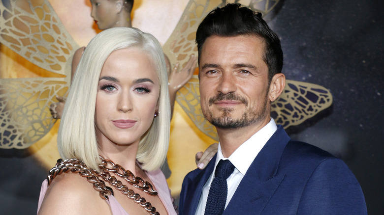 Katy Perry blonde hair, Orlando Bloom smiling