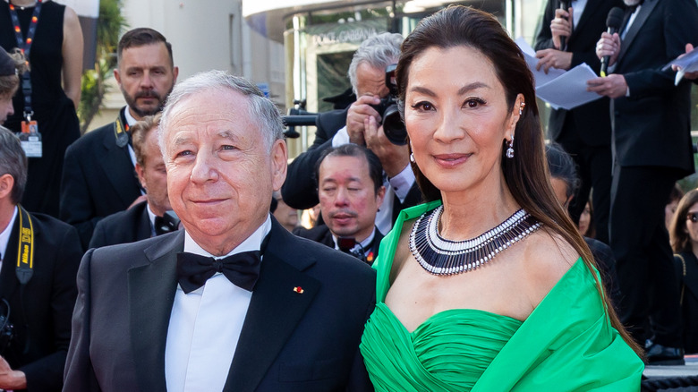 Jean Todt smiling with Michelle Yeoh green dress