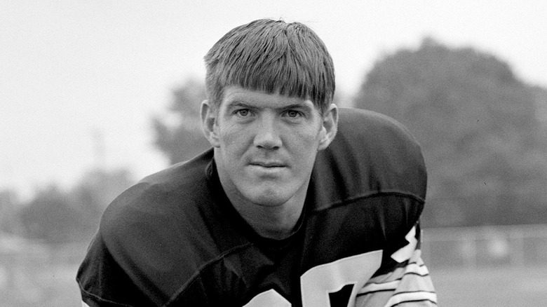 Jerry Smith posing in football uniform