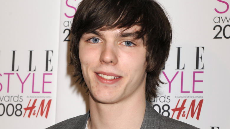 Young Nicholas Hoult smiling