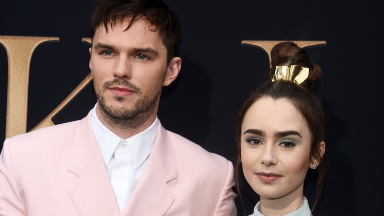 Nicholas Hoult and Lily Collins posing