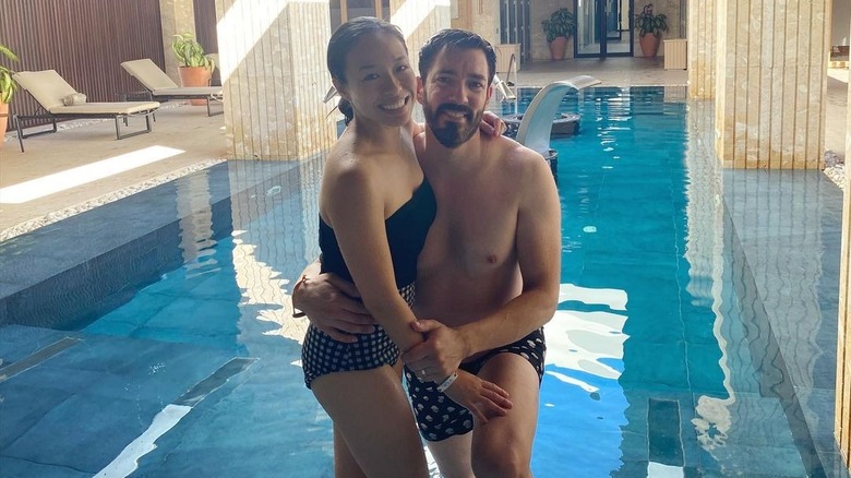 Linda Phan, Drew Scott posing in pool