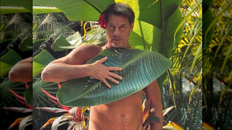 Ty Pennington covering chest with leaf