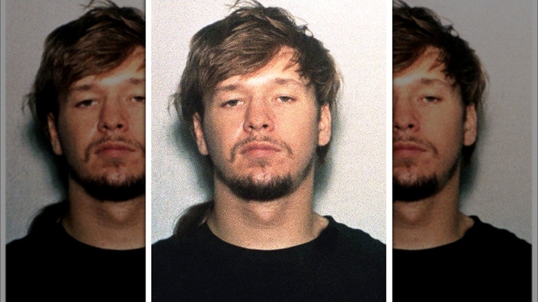 Donnie Wahlberg frowning in mugshot