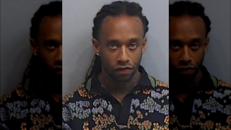 Ty Dolla Sign scowling in mugshot