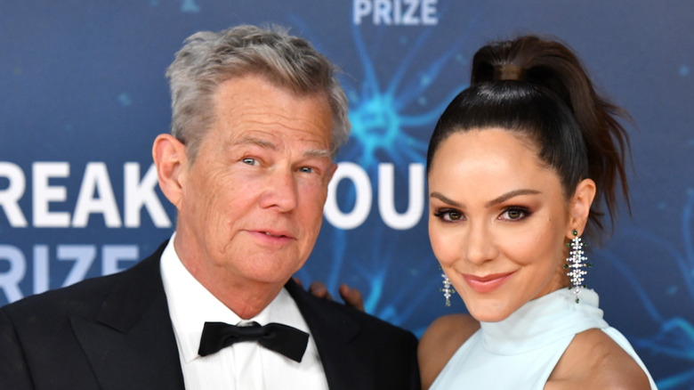 Katharine McPhee and David Foster posing on a red carpet