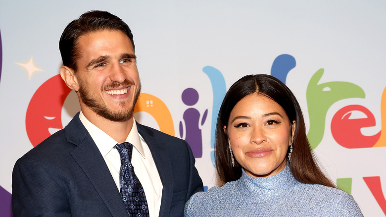 Gina Rodriguez and Joe LoCicero posing at an event