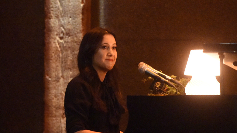 Vanessa Carlton sitting at a piano