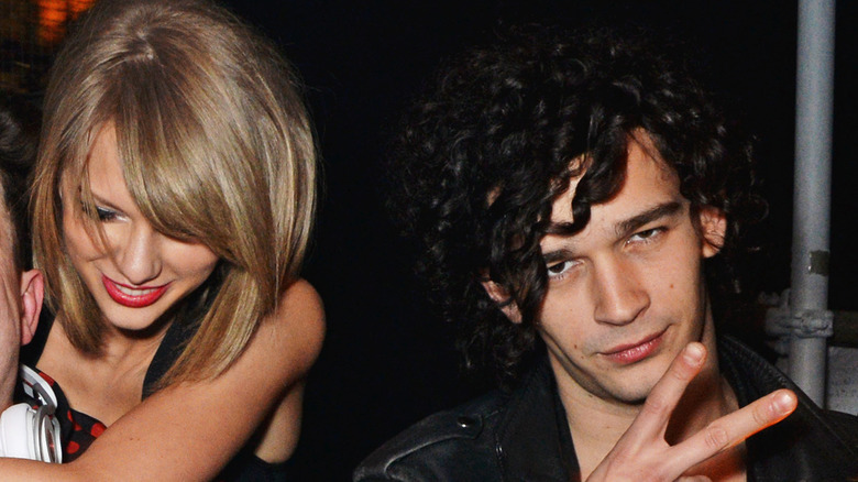 Taylor Swift next to Matt Healy, posing