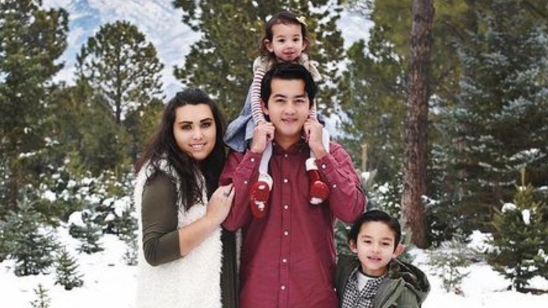 Izabella Tovar and Jairo Rodriguez posing with their children