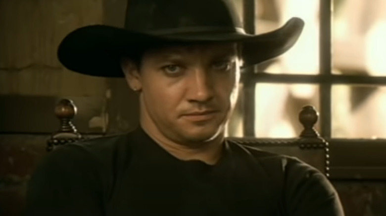 Jeremy Renner wearing black cowboy hat