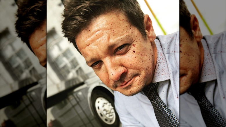 Jeremy Renner with blood spatter on face