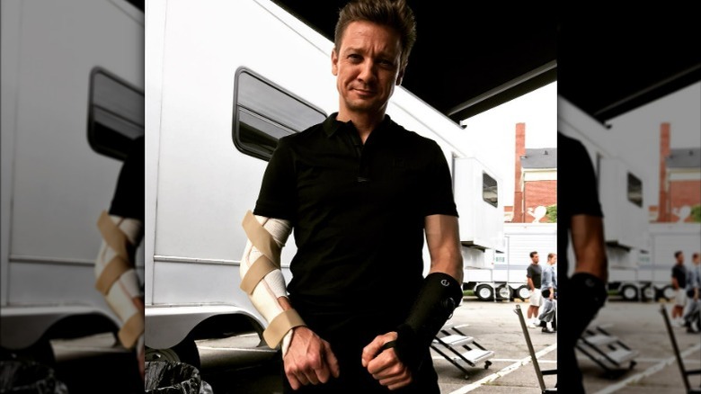 Jeremy Renner with arms in casts