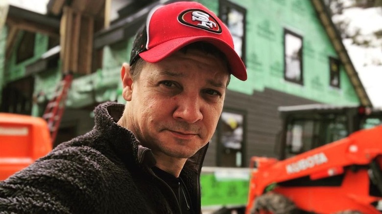 Jeremy Renner wearing 49ers hat