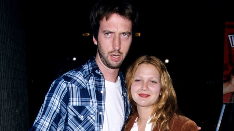 Tom Green and Drew Barrymore posing at a movie premiere 