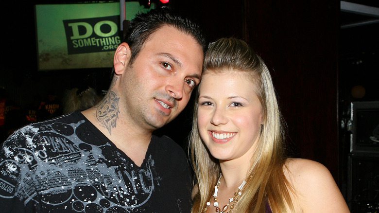 Jodie Sweetin posing with ex-husband Cody Herpin at an event