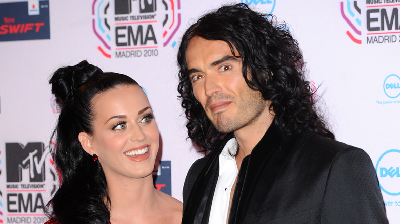 Katy Perry and Russell Brand posing at an event