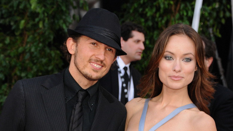 Olivia Wilde and Tao Ruspoli posing on a red carpet