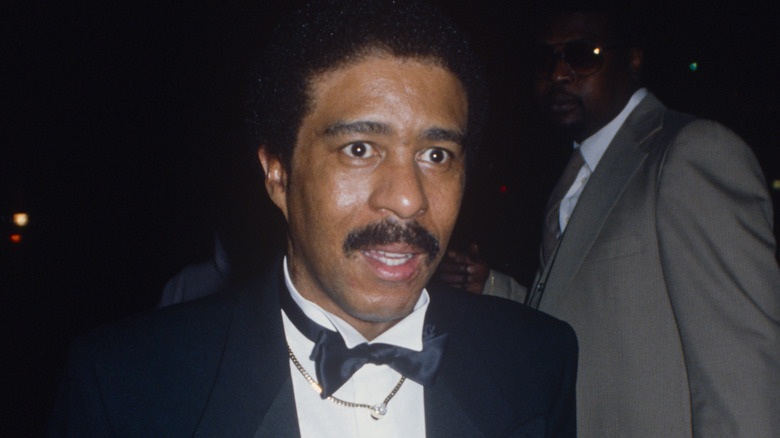 Richard Pryor posing in a tuxedo