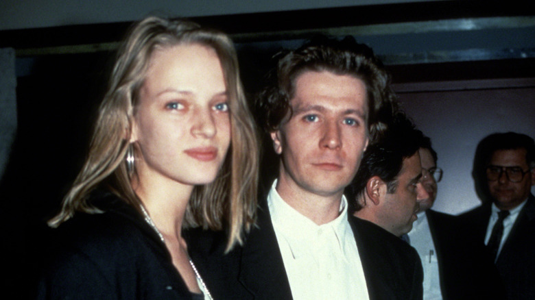 Uma Thurman and Gary Oldman looking into the camera