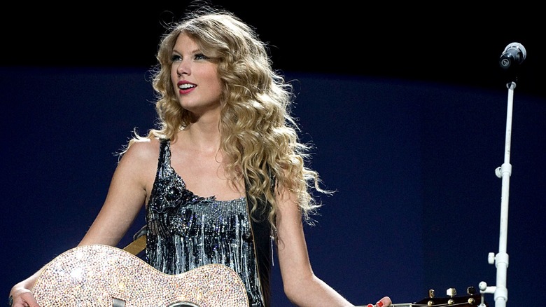 Taylor Swift onstage with guitar