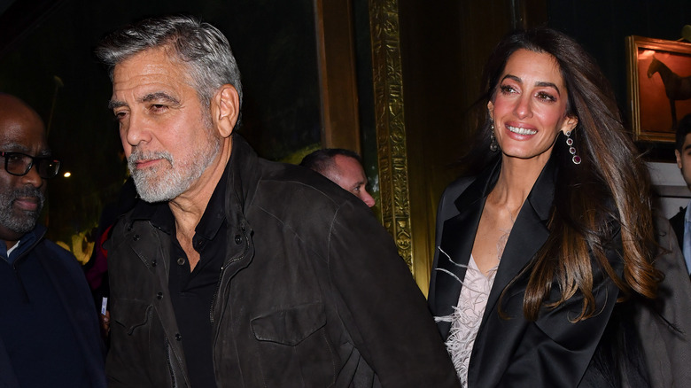 George and Amal Clooney walking