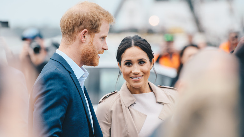 Meghan Markle glancing at Prince Harry