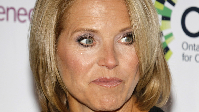 Katie Couric looking to the side wide eyes