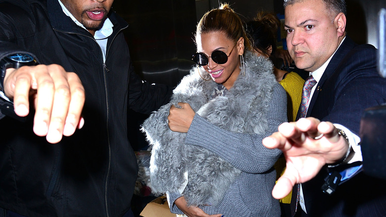 Beyonce carrying concealed Blue Ivy