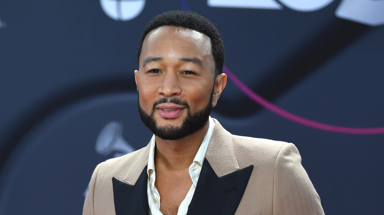 John Legend posing at an event