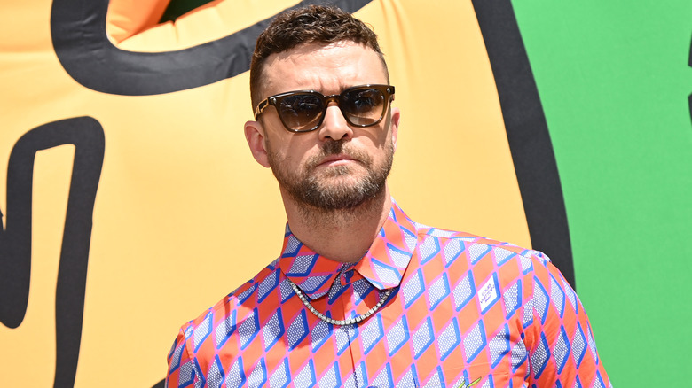 Justin Timberlake posing with sunglasses on