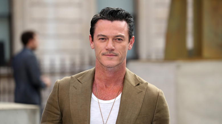 Luke Evans posing outdoors