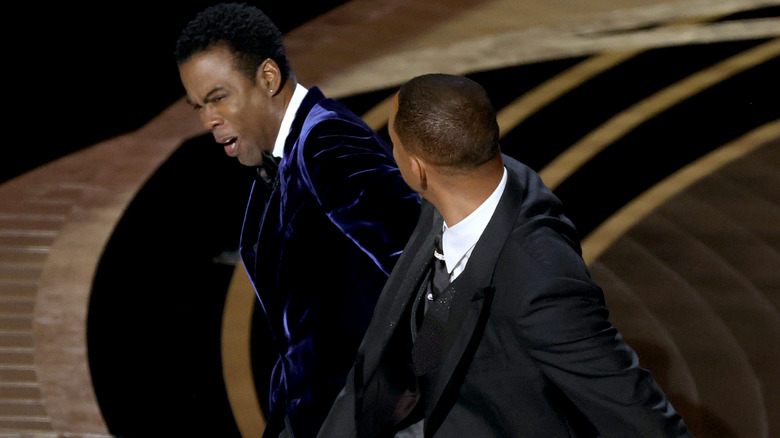 Will Smith, slapping Chris Rock across the face