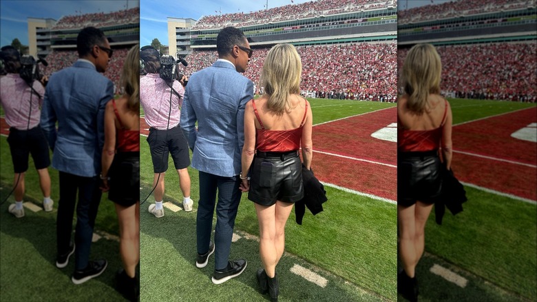 T.J. Holmes and Amy Robach at football game